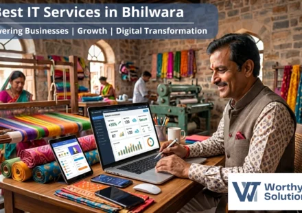 A local business owner using a laptop in a textile workshop, representing the Best IT Services in Bhilwara provided by WorthyTech Solutions.