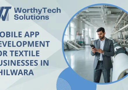 Promotional banner for WorthyTech Solutions advertising "Mobile App Development for Textile Businesses in Bhilwara," featuring a business professional using a smartphone on a modern textile factory floor.